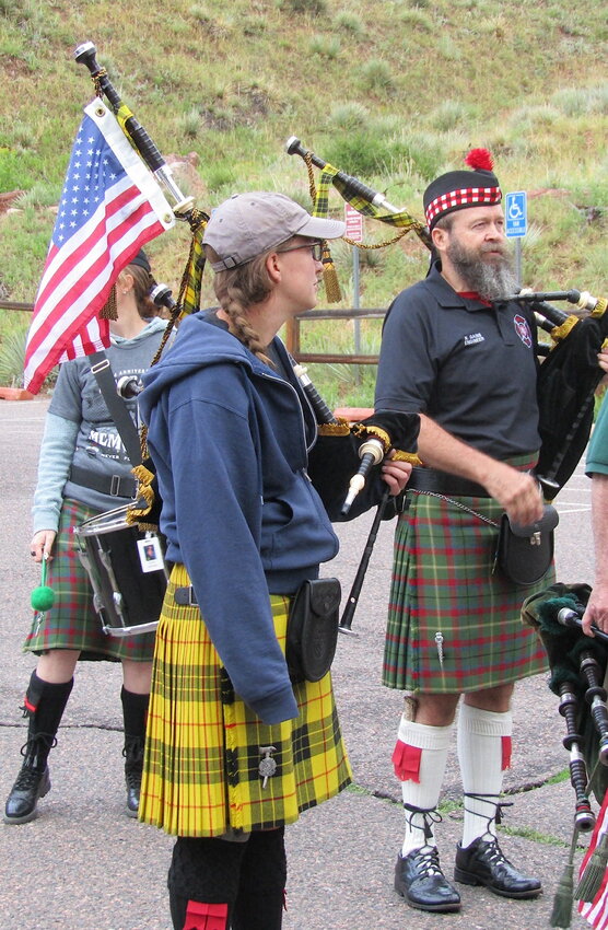 Bagpipers Megan Larson of Arvada and Norbert Gains of Lakewood, who are members of the Colorado Emerald Society, prepare to perform before the walk begins.